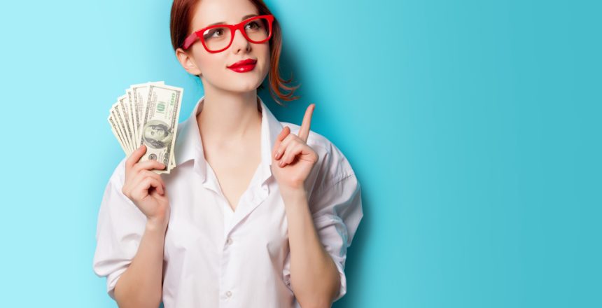 Portrait,Of,Redhead,Women,In,Red,Glasses,With,Money,On